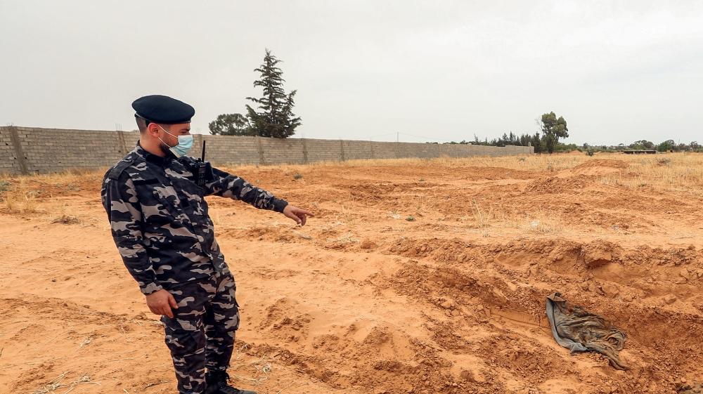 Twelve bodies found in Libya mass graves