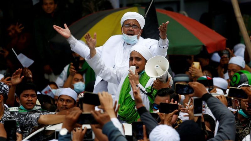 Indonesia court gives hardline cleric jail term for flouting COVID-19 curbs